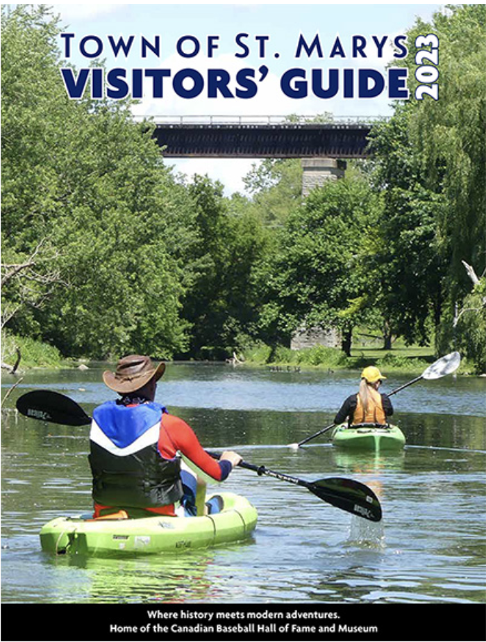Cover image for town of St. Marys Visitor Guide. Two people kayaking on a river.